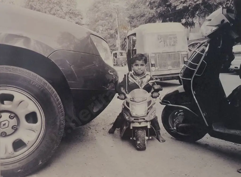 UNKNOWN photographer - Small Boy on Mini Motorbike (India) Image 1++