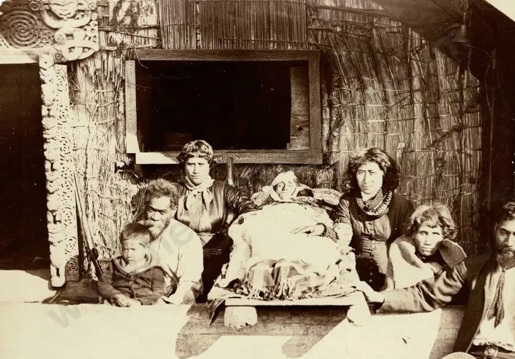 UNKNOWN - Maori Family with  Deceased Family Member Outside Whare - Late 19th Century Image 1++